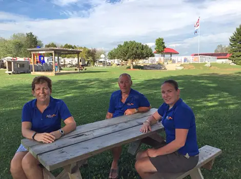 The Maat family sitting at a picnic table